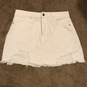 White denim skirt with rips